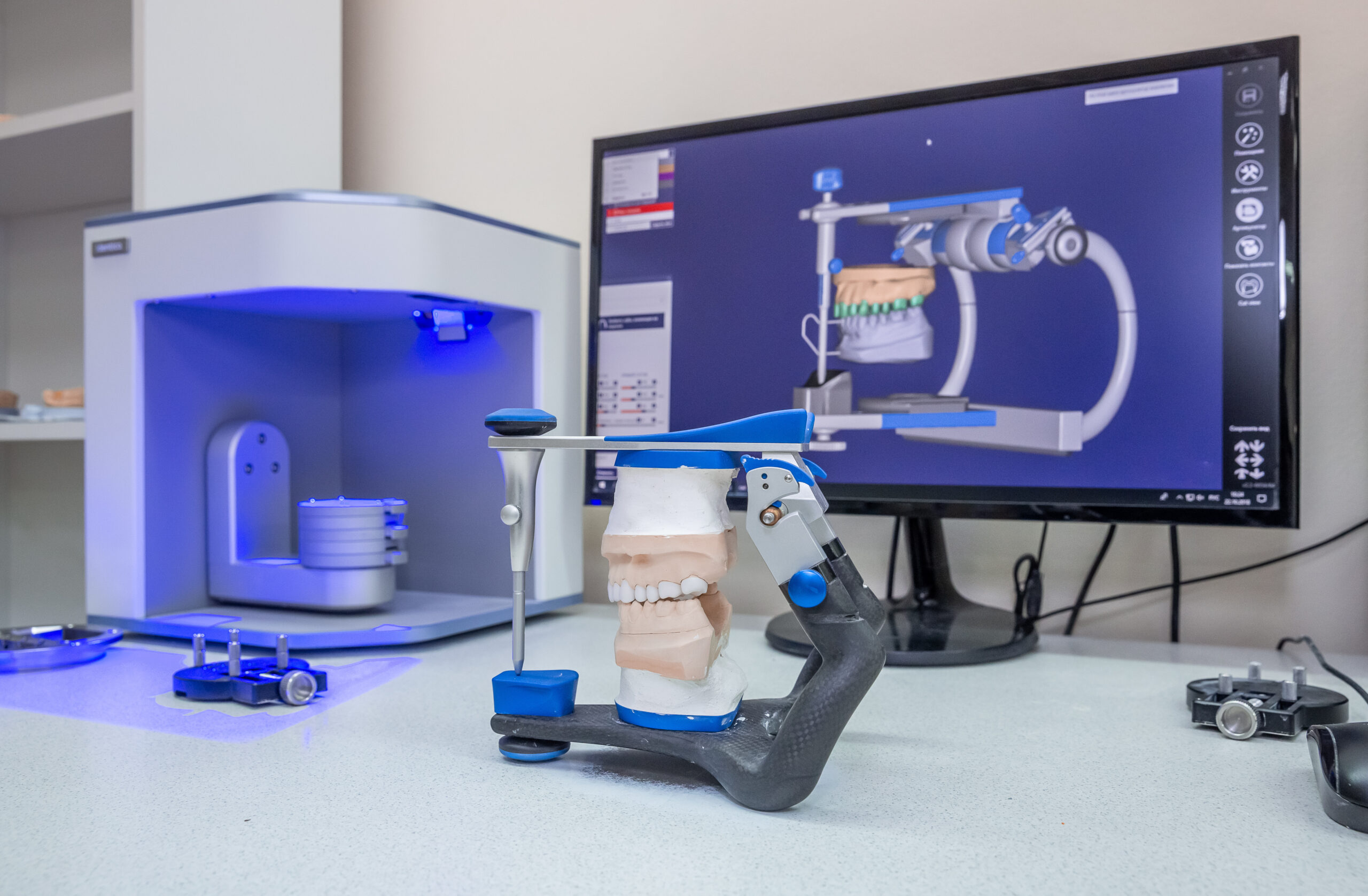 3D scanner and PC on the table in the process of creating dentures